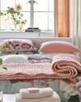 Chenevard Reversible Quilt Blossom & Peach by Designers Guild Bedding